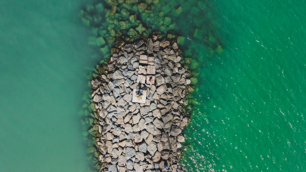 a group of people on a rock