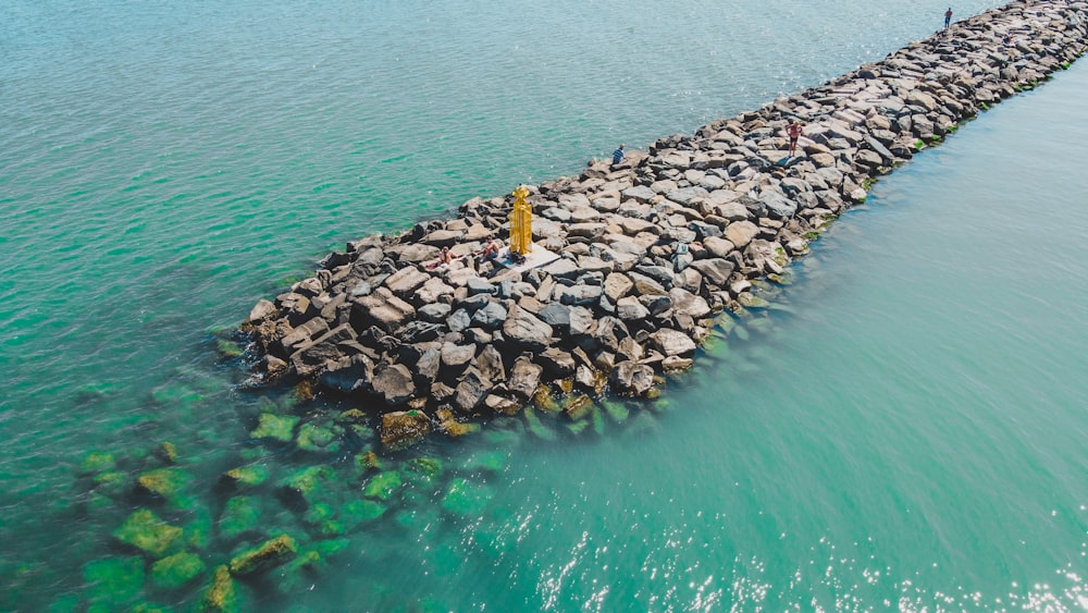 a pile of rocks in the water