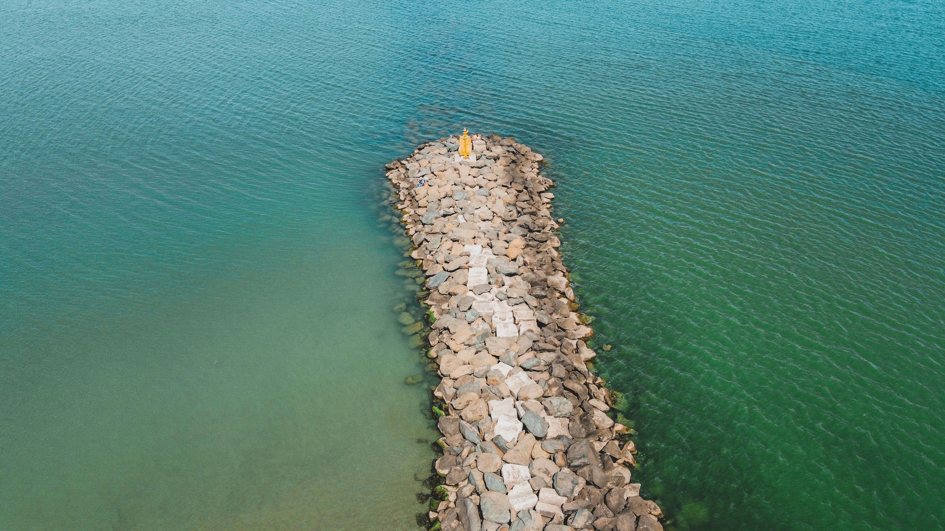 a stack of rocks in the water