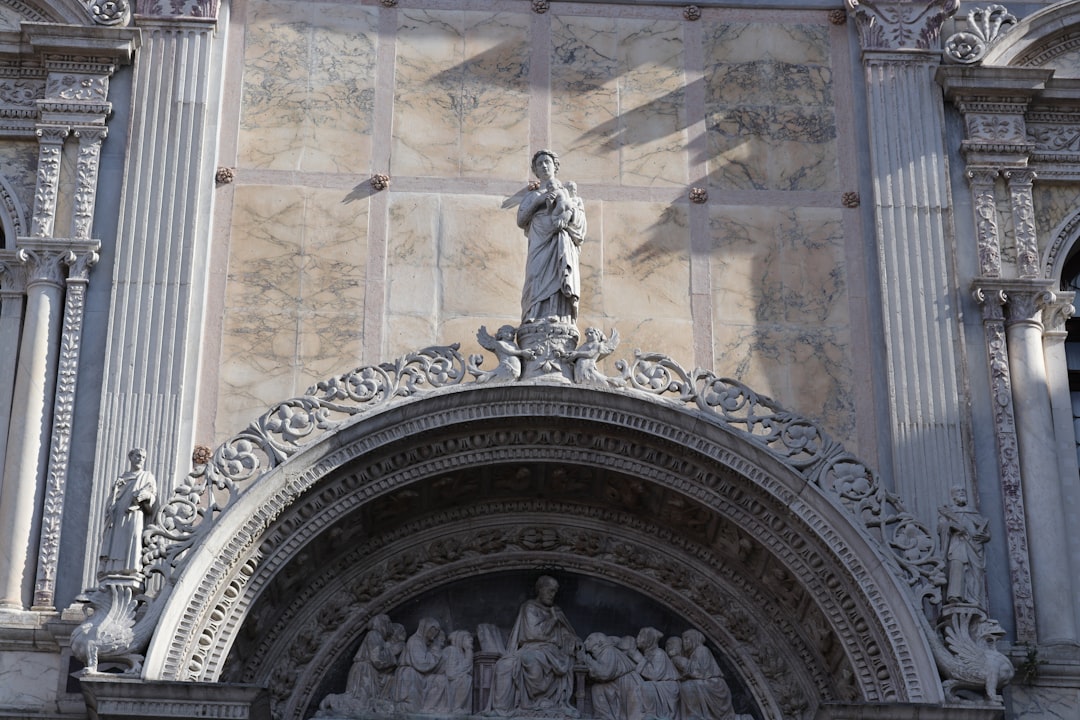 a statue in a building, Architectural detail found on the Great School of Saint Marco