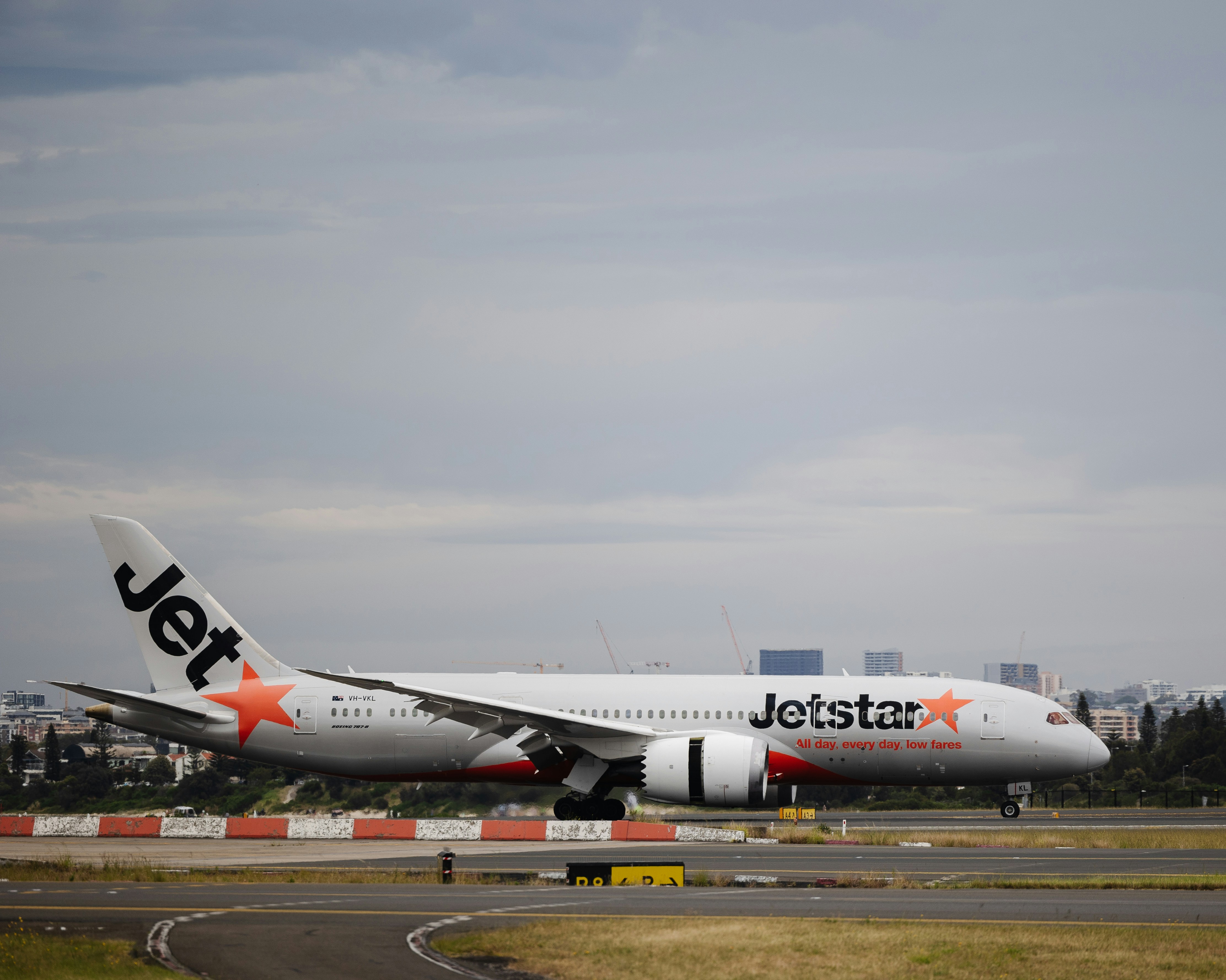 an airplane on the runway, Jetstar VH-VKL