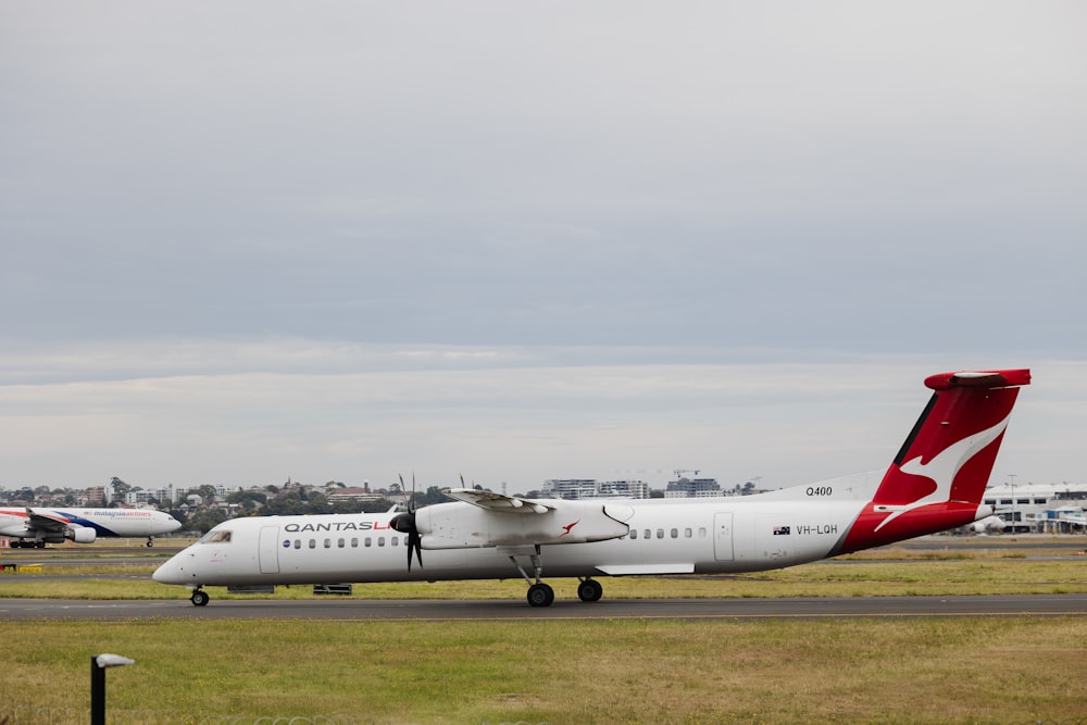 a large white airplane on a runway