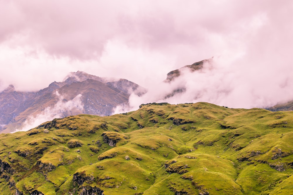 a mountain range with clouds