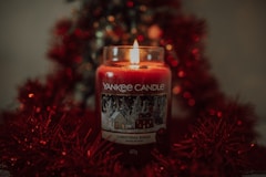 a candle in a glass jar