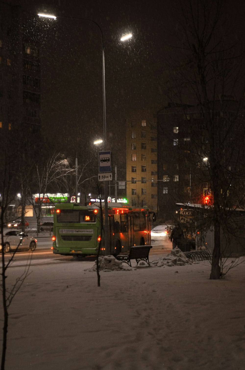 a bus driving through the snow