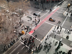 a high angle view of people crossing a street
