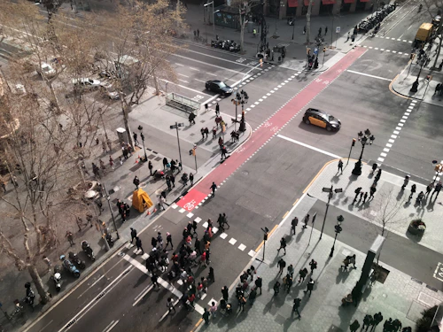 a high angle view of people crossing a street