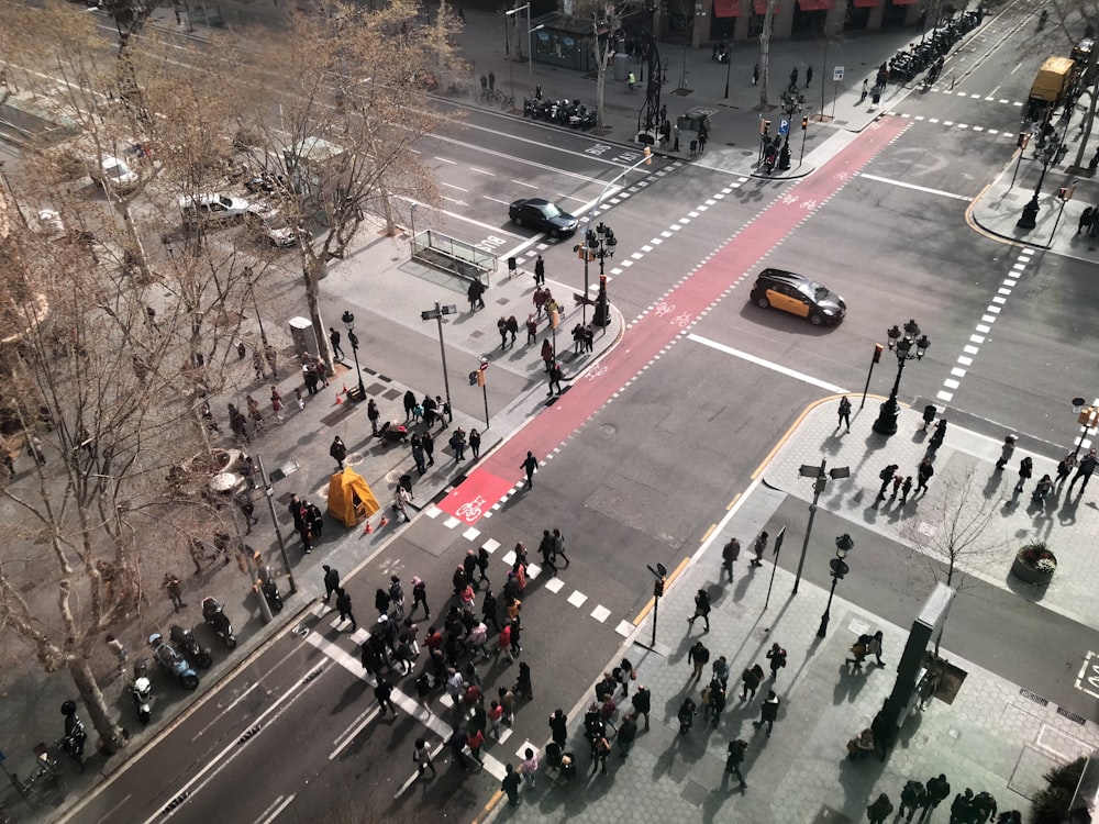 a high angle view of people crossing a street