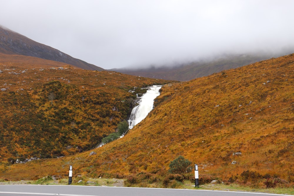 a waterfall in a valley