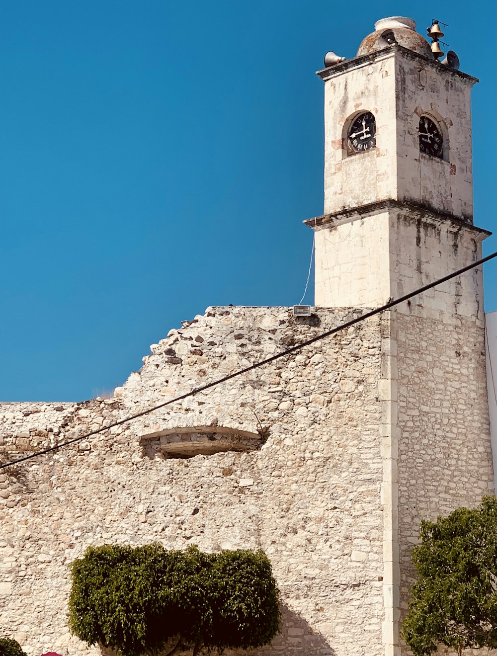 a stone building with a tower