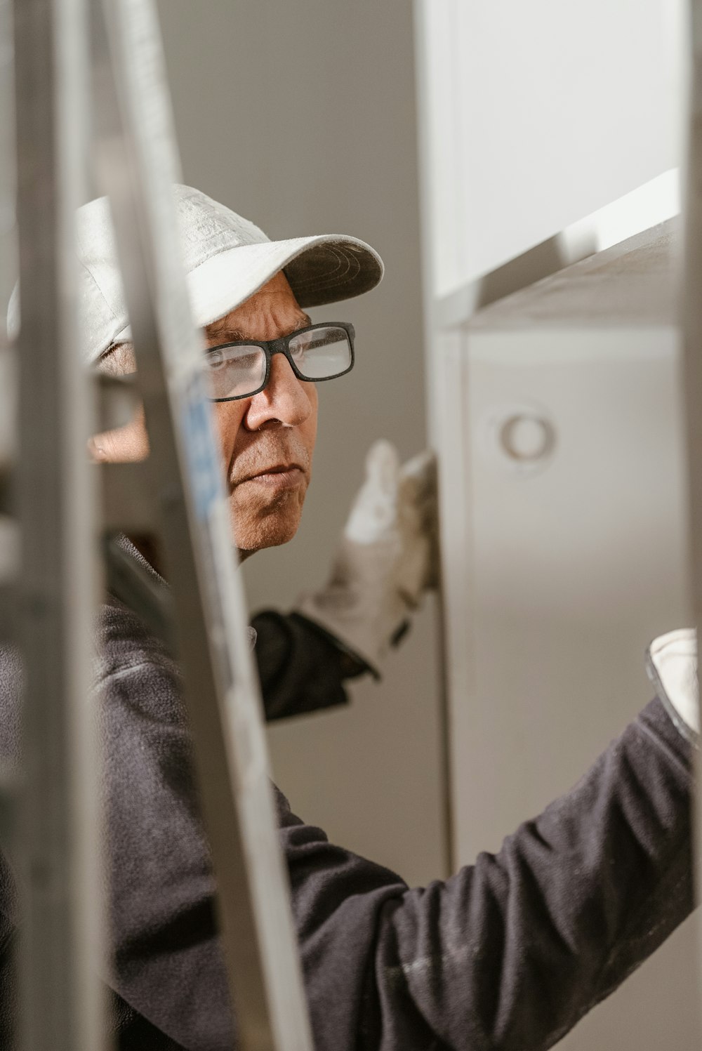 a man wearing a hat and glasses