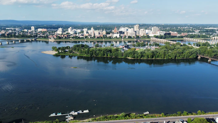 a body of water with a city in the background