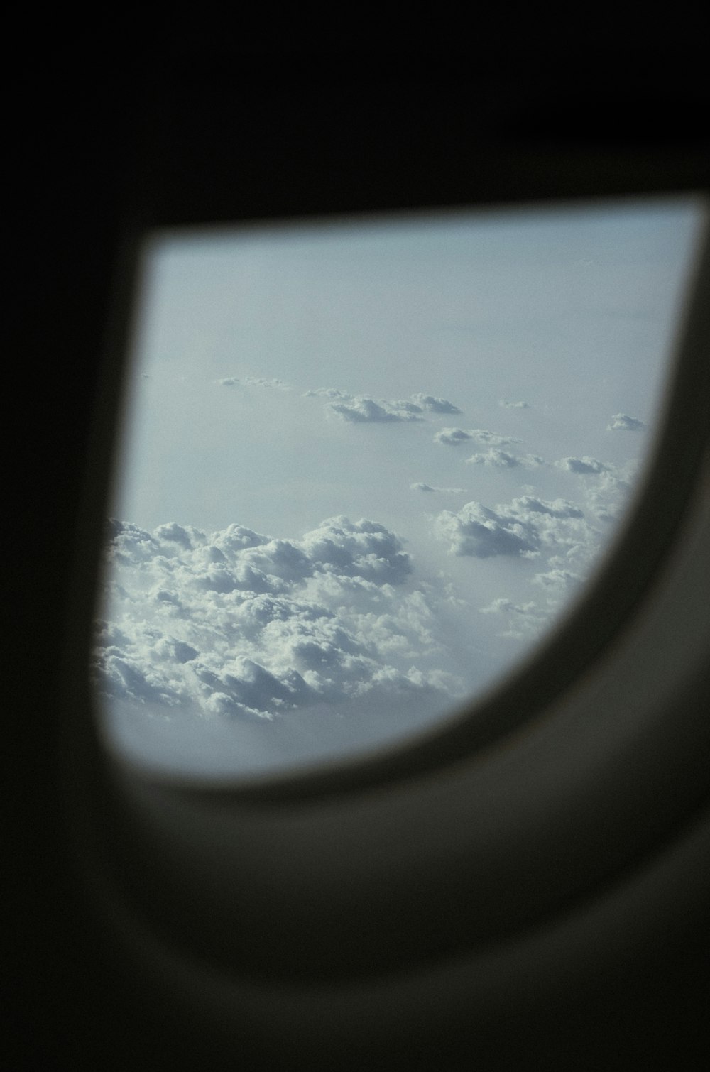 an airplane window with clouds