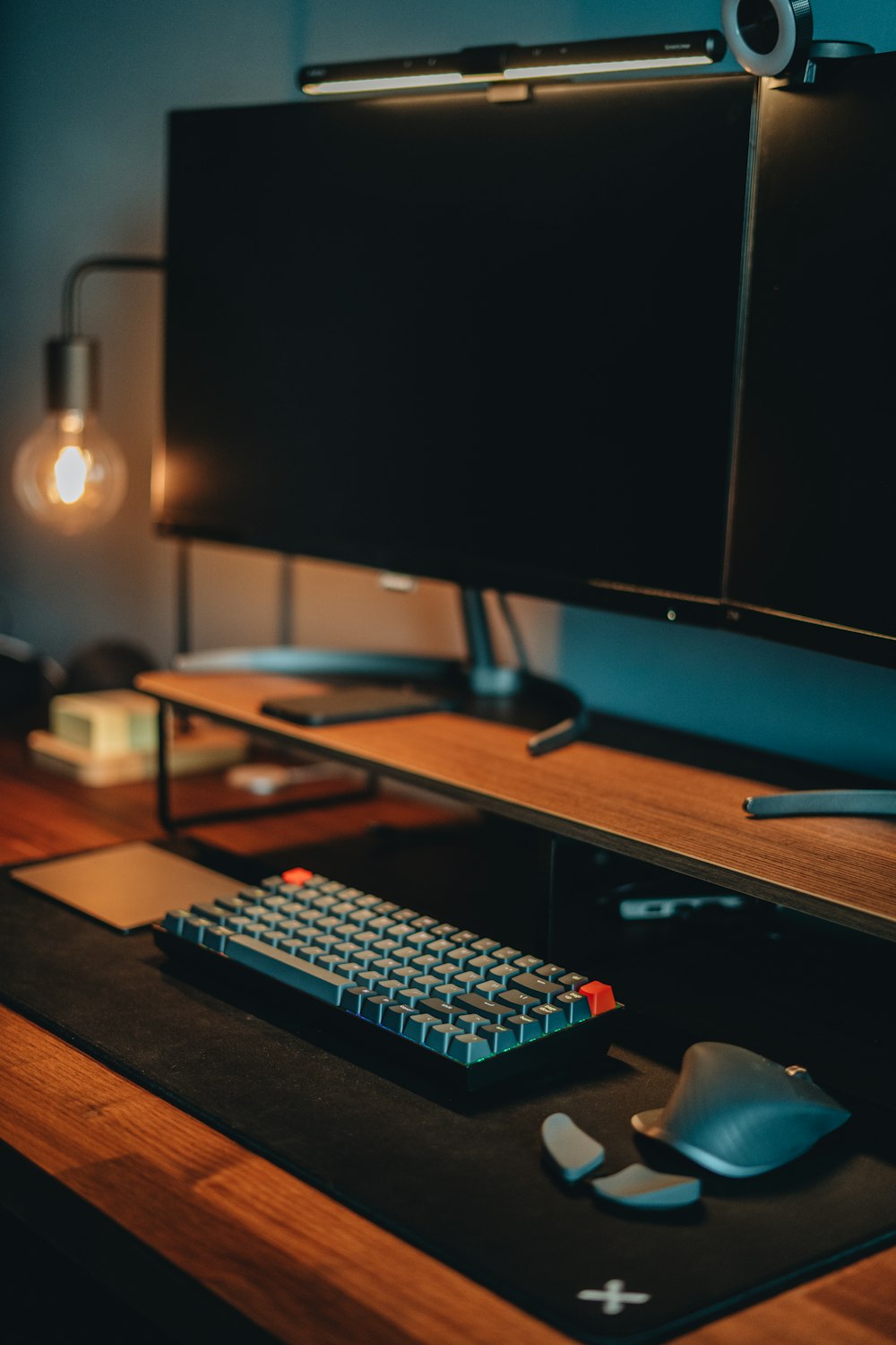 a computer monitor and keyboard on a desk