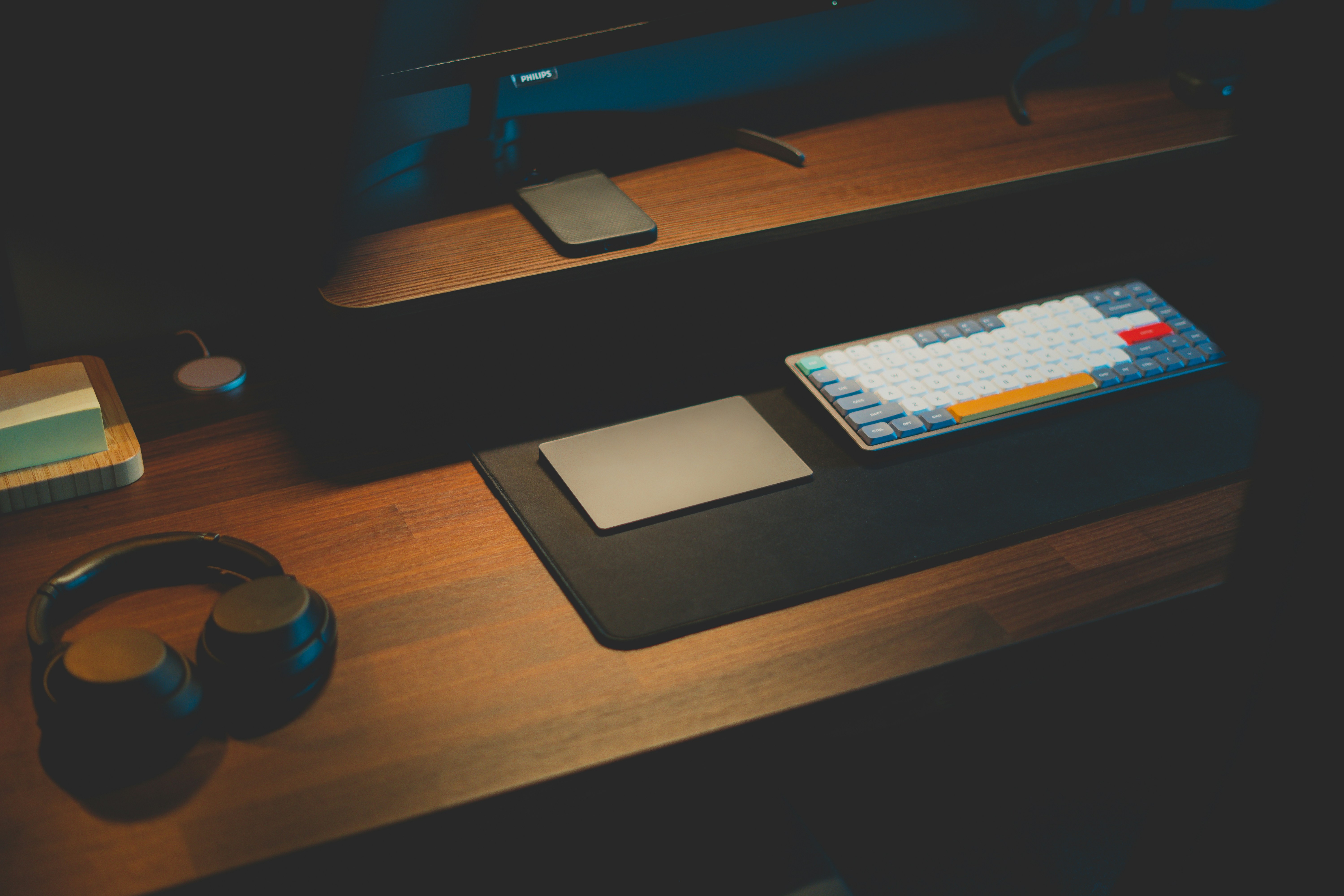 clean desk workspace with smartphone displaying operating system settings screen