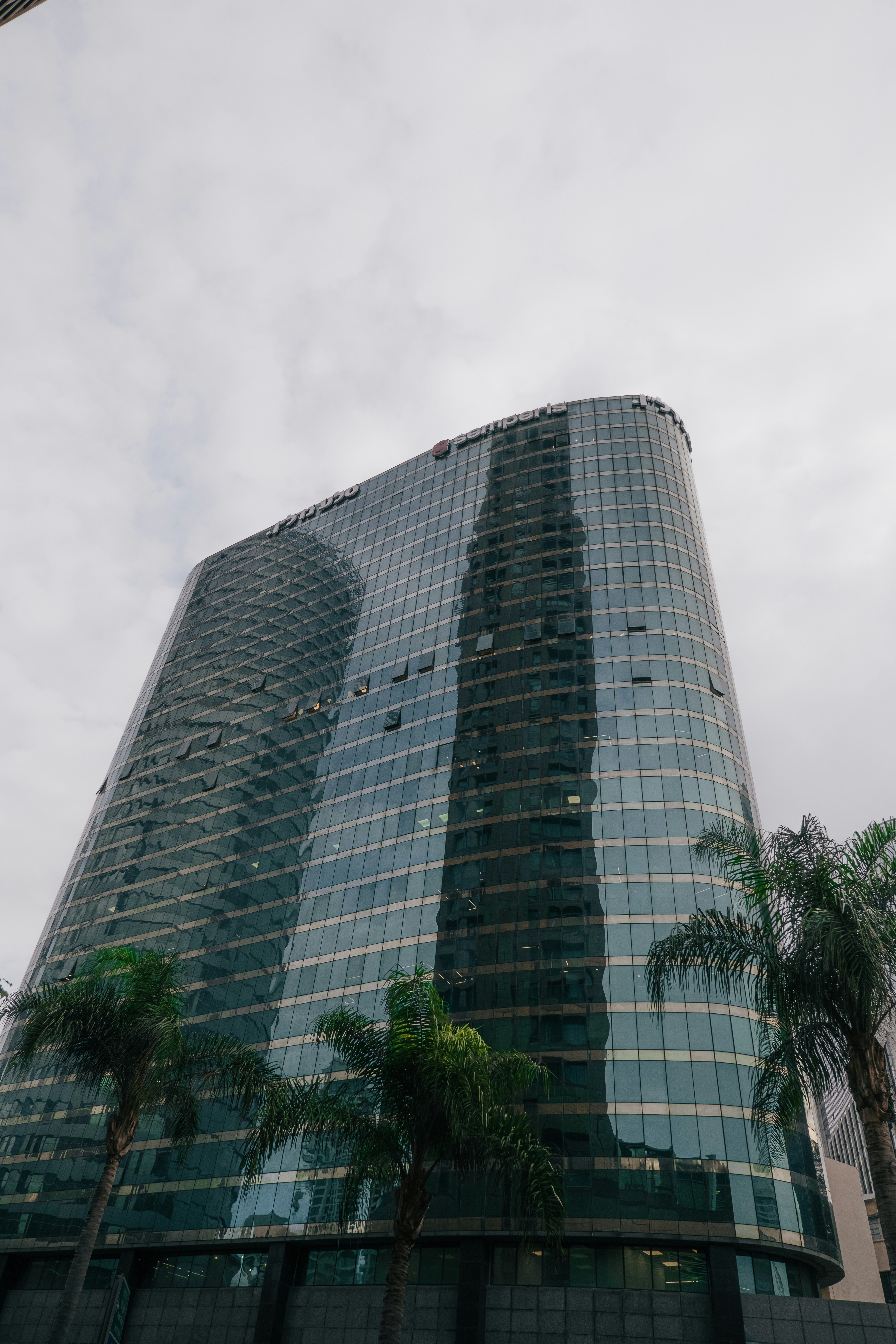 a tall building with trees in front of it