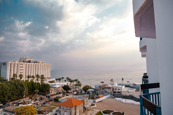 A view of a city with a body of water in the background — Galilee & the Sea of Galilee, Israel