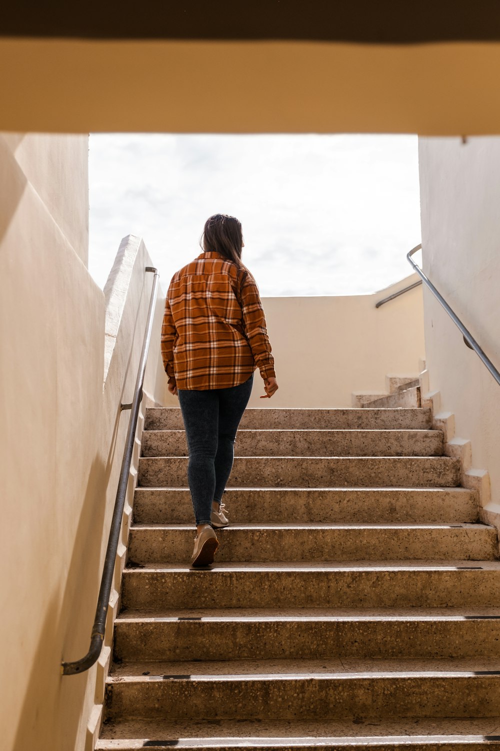 a person walking up a flight of stairs