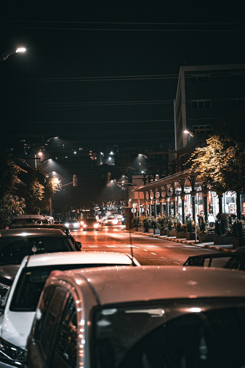 a street with cars on it and buildings on the side