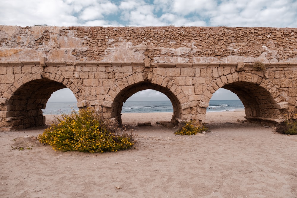 a stone bridge with arches