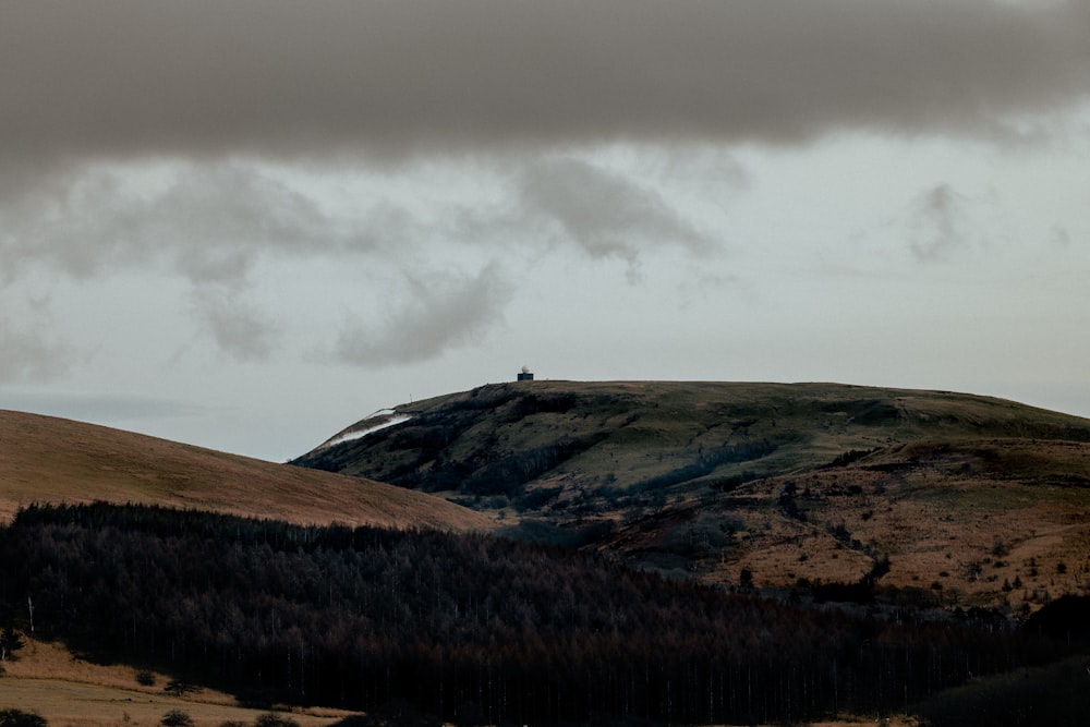 a landscape with hills and clouds