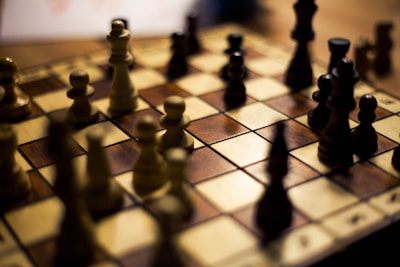 A colorful chessboard with pieces arranged for a game.