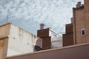 Wide shot of a renovated rooftop with a smooth, even paint finish capturing local architecture style.