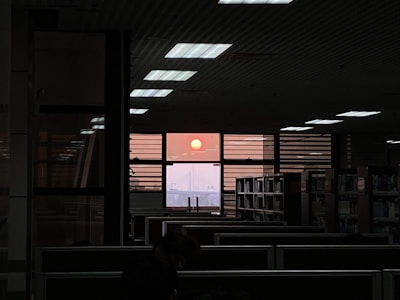 An inspiring shot of a sunset viewed through the office window, symbolizing new ideas.