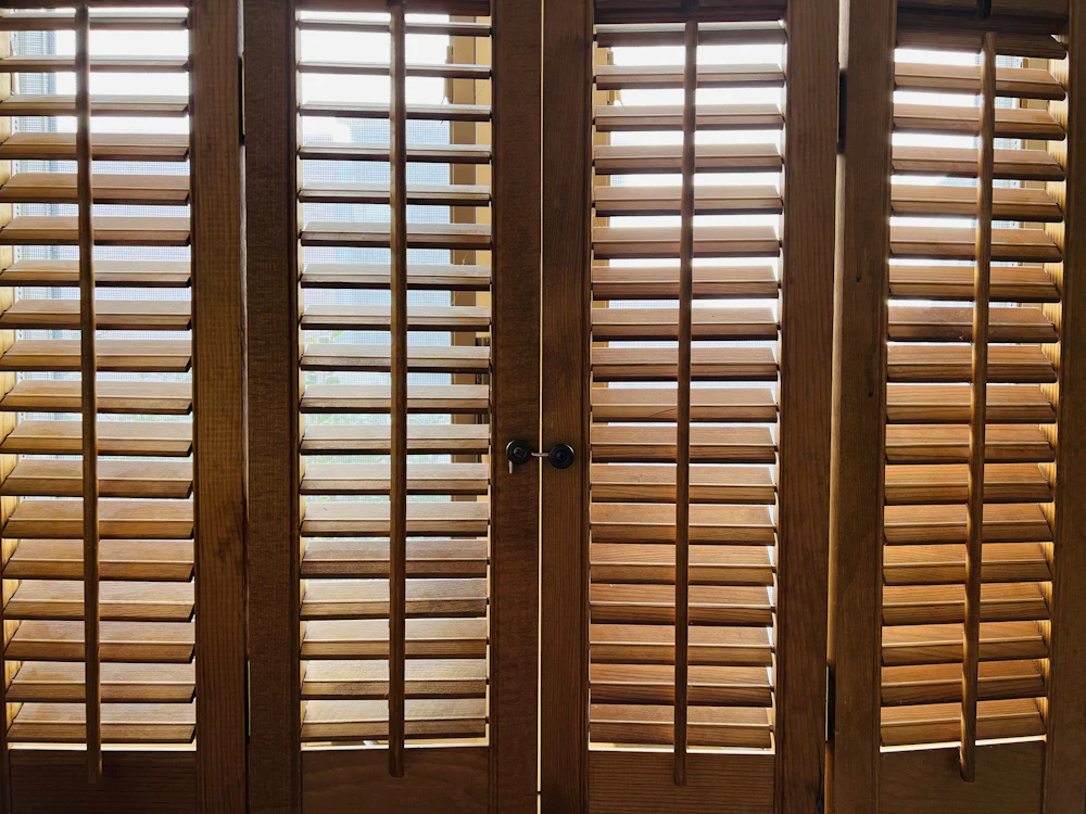 Stained wooden plantation shutters