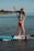 a woman on a paddle board