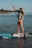 a woman on a paddle board