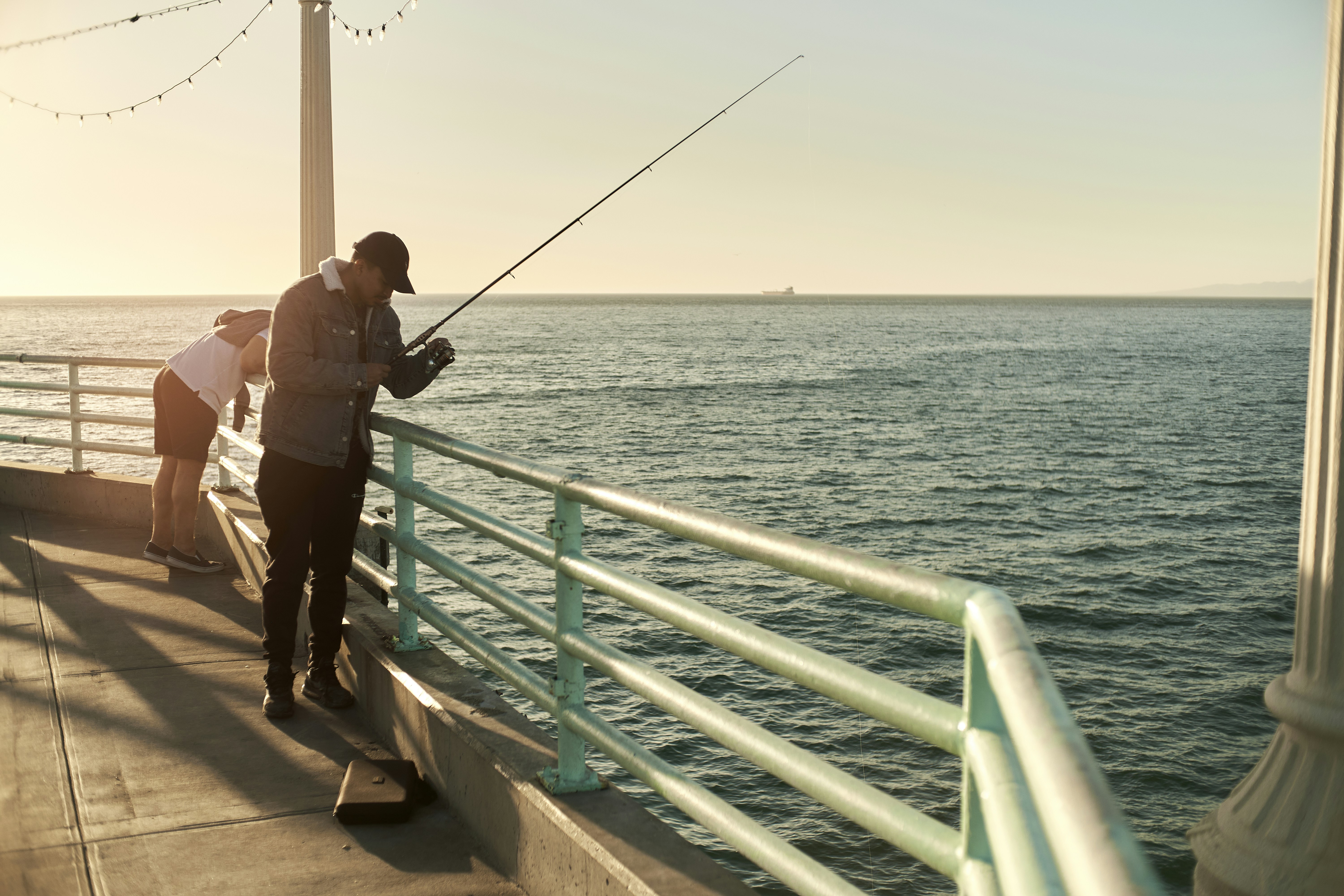 a person fishing on a boat, 