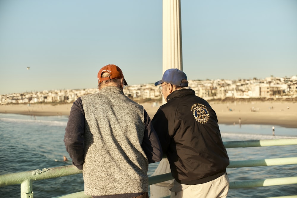 two people looking at a tall tower