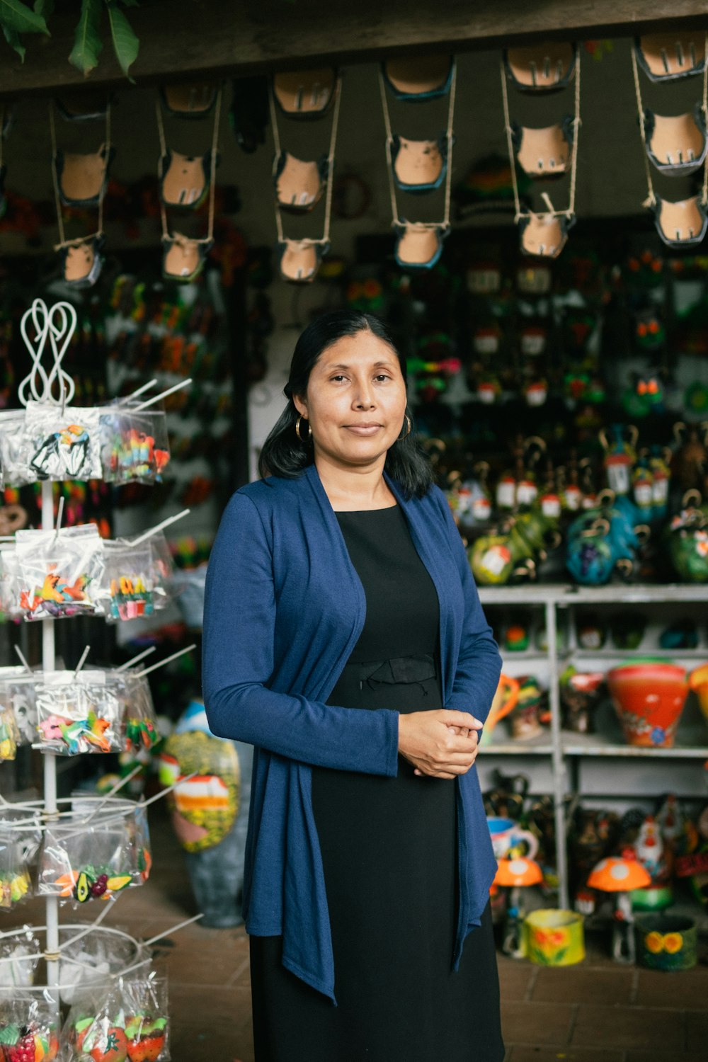 a person standing in front of a display of jewelry