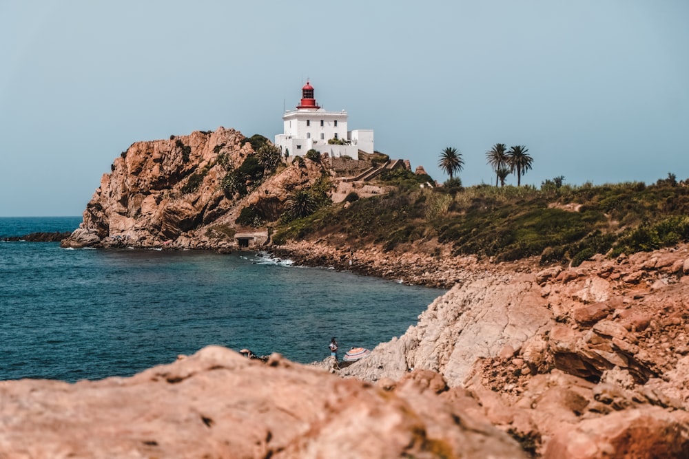 a lighthouse on a rocky island