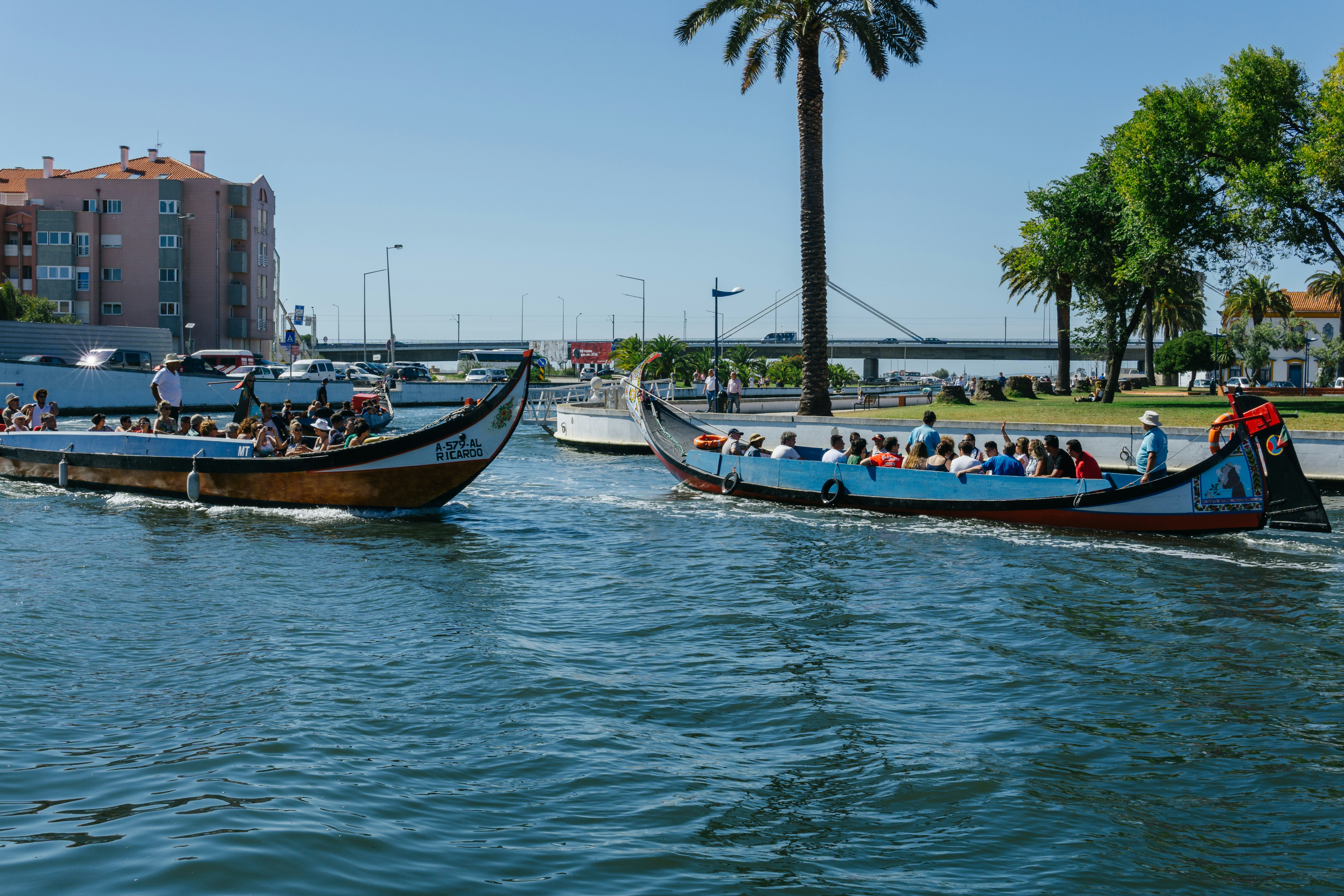Canal boat in Aveiro, Portugal with people sightseeing