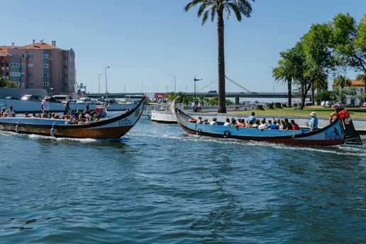 a group of people riding on top of boats in the water