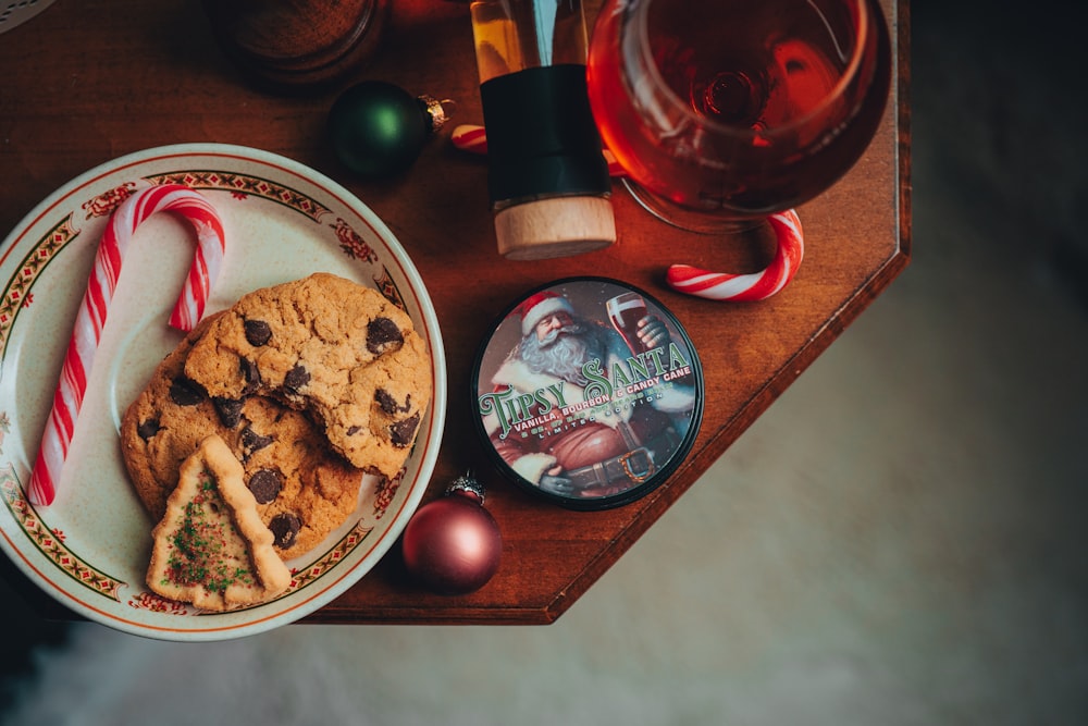 a plate of cookies and candy canes on a table