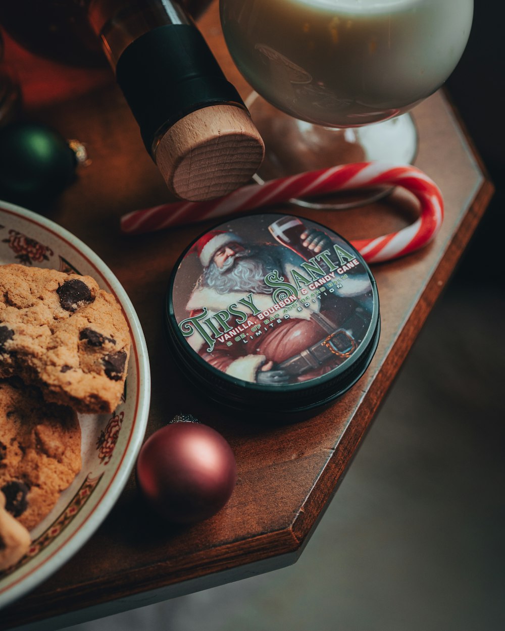 a plate of cookies and candy canes on a table