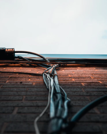 Detailed image of a GI raceway cable tray installed along a commercial building wall in Mumbai.