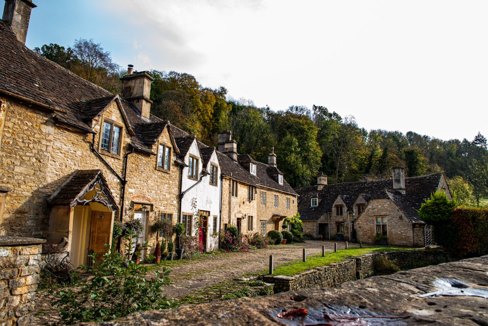 a cobblestone street lined with stone houses