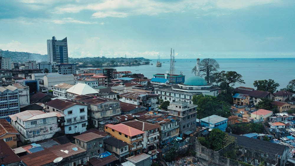 a view of a city with a body of water in the background