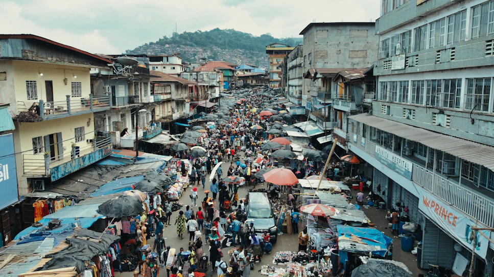 A vibrant street market in Brazil bustling with colorful stalls and lively crowds.