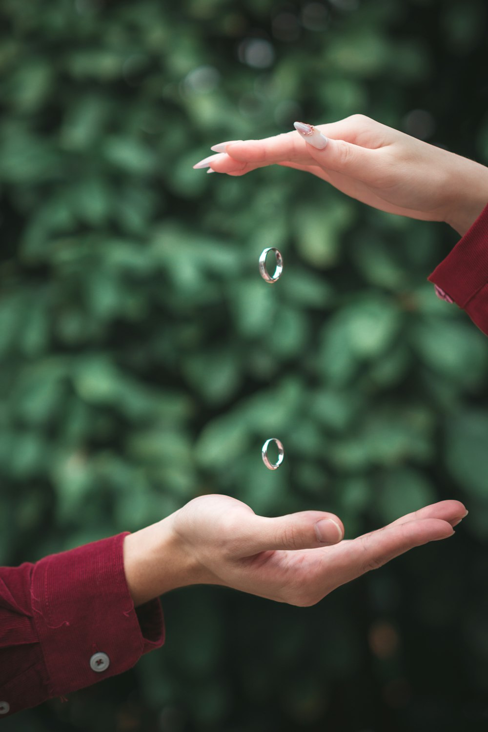 a person holding out their hands with soap bubbles in the air
