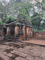A serene temple surrounded by lush greenery.