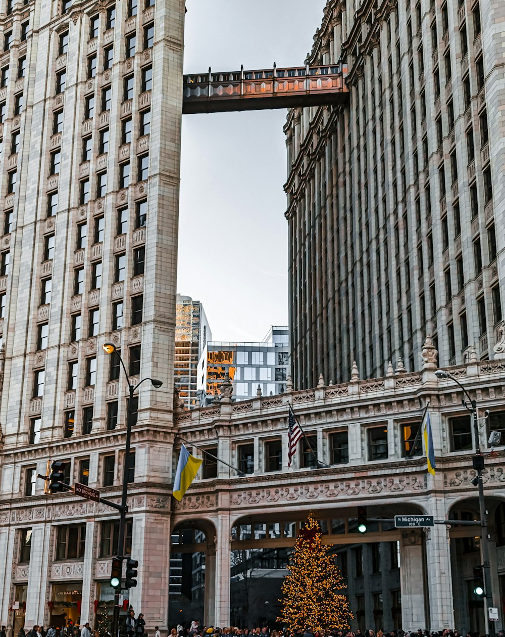 a very tall building with a christmas tree in front of it