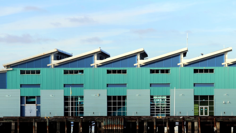 a row of blue buildings sitting next to each other