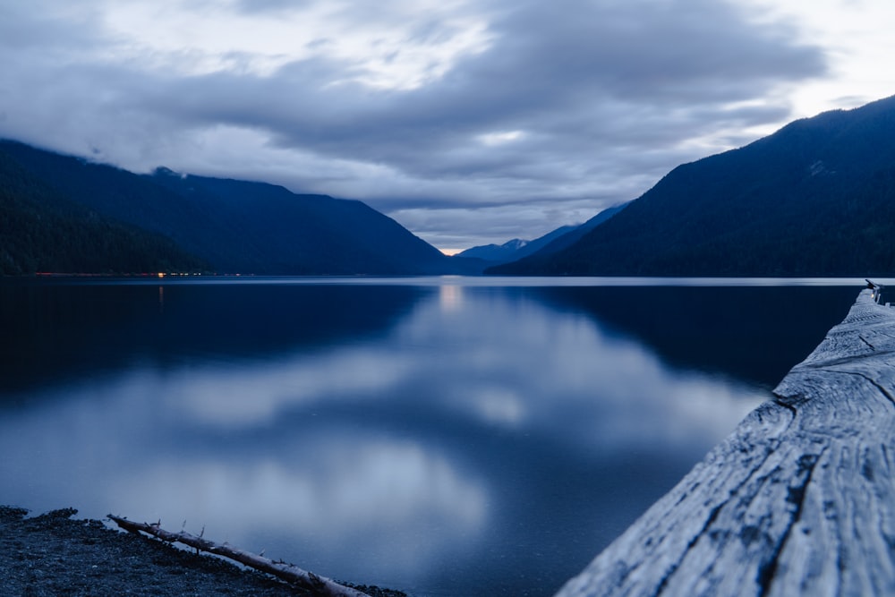 a view of a body of water with mountains in the background