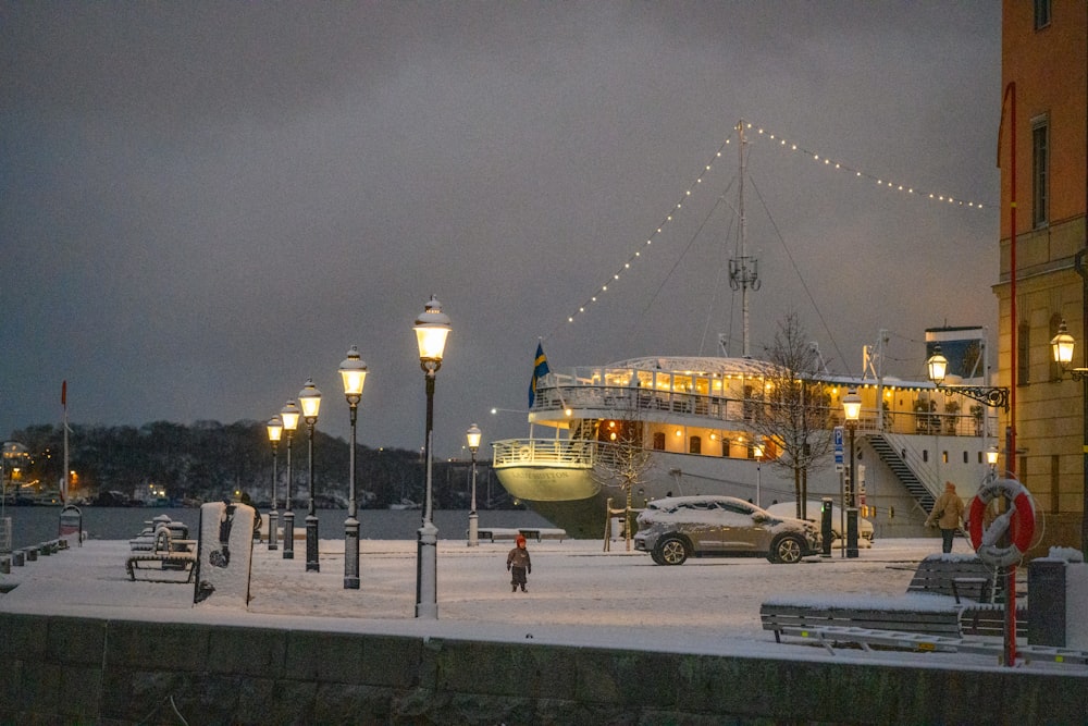 a boat is docked in a snowy harbor