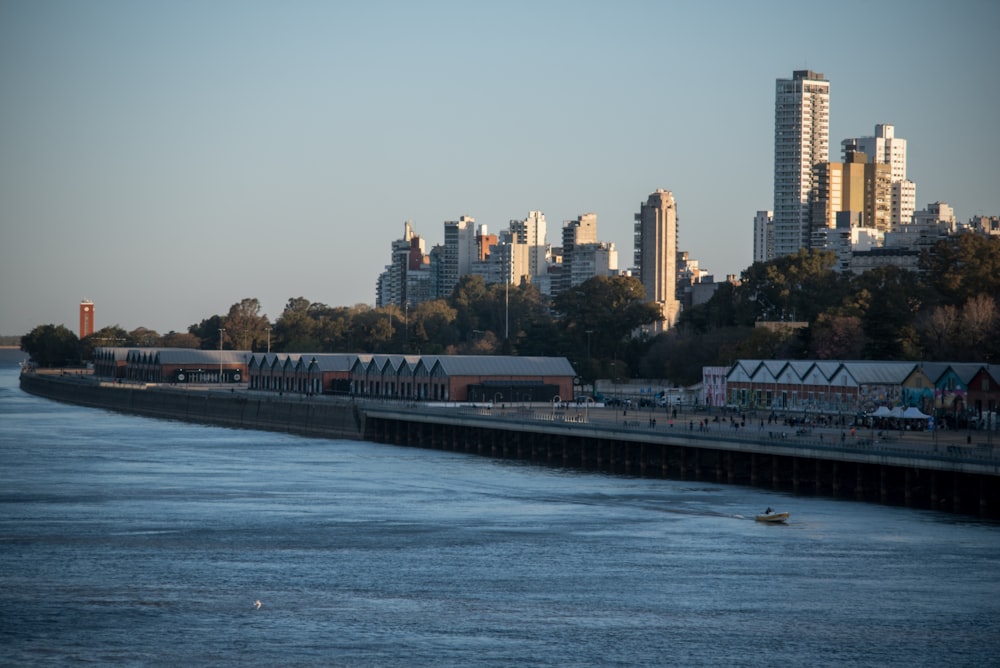 a train traveling down a train track next to a body of water